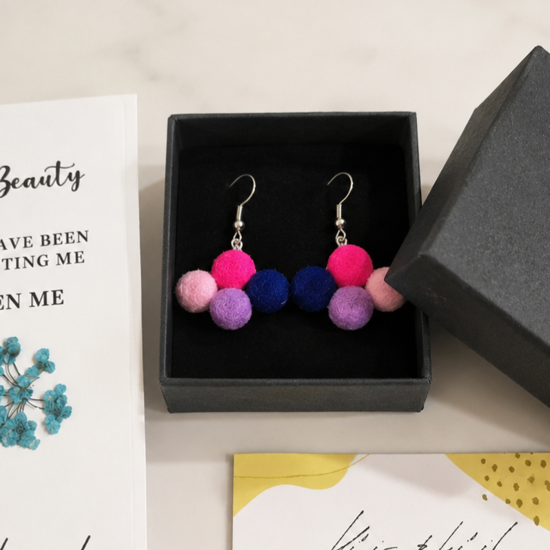 Pendientes de plata diseño  con pompones