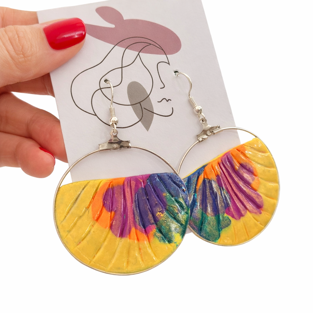 Silver earrings with embossed and metallic effect