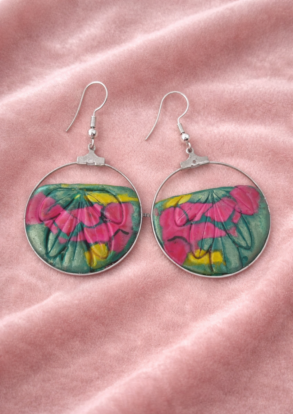 Sterling silver earrings with a very spring-like relief