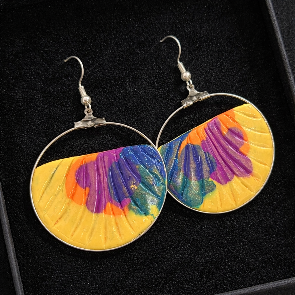 Silver earrings with embossed and metallic effect